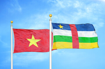 Vietnam and Central African Republic  two flags on flagpoles and blue sky