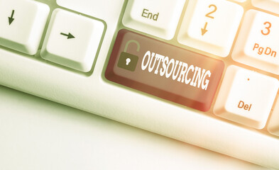 Word writing text Outsourcing. Business photo showcasing obtain goods or a service from an outside...