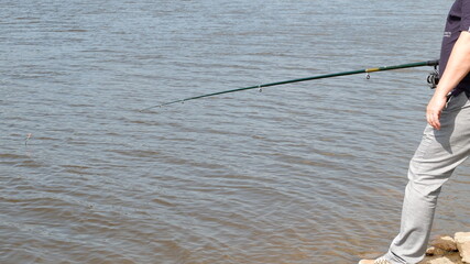 man fishing on the river