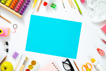 Colorful school background with blank sheet of paper. Back to school. Flat lay.