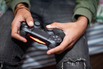 Close up shot of teenager playing video games