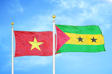 Vietnam and Sao Tome and Principe two flags on flagpoles and blue sky