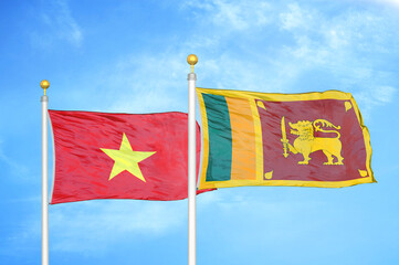 Vietnam and Sri Lanka two flags on flagpoles and blue sky