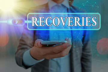 Text sign showing Recoveries. Business photo showcasing process of regaining possession or control...