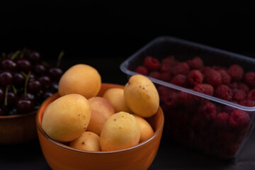 Various fruits on black background