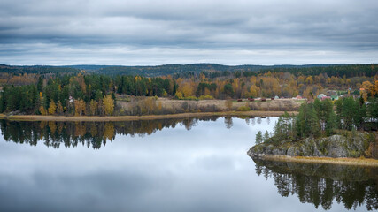 View from the top of the Snake Mountain on Lake Ladoga and a stone .Coast  with a forest, Skhera, near the town of Lahdenpohja in Karelia, Russia, in the autumn day
