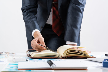 Close-up businessman hand writing to do list