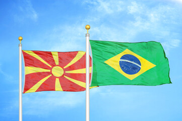 North Macedonia and Brazil two flags on flagpoles and blue sky
