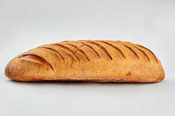 Organic bread on white background. Loaf of french bread. Space for text.