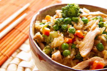 Fried asian rice with chicken and vegetables