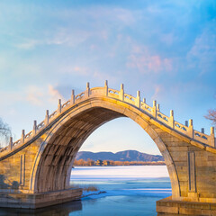 Xiuyi bridge, stands at the largest estuary of Kunming Lake and links the lake with Chang River, feed the flow to the lake and and moats of the Summer Palace