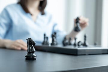 Knight standing in front of people hand move chess with strategy and tactic to win enemy, play...