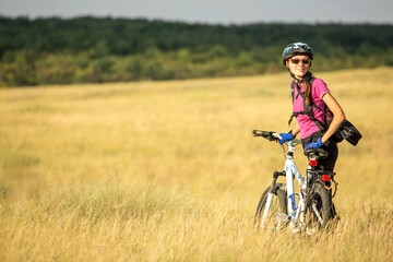 Happy cyclist woman enjoy her travel offroad