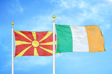 North Macedonia and Ireland two flags on flagpoles and blue sky