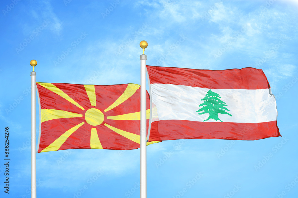 Wall mural north macedonia and lebanon two flags on flagpoles and blue sky