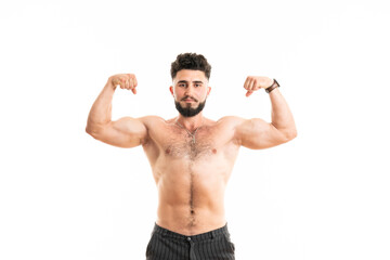 Muscular man bodybuilder isolated on a white background. Male shows his muscles