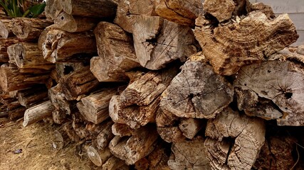 Heaps of old teak wood damaged by corrosion