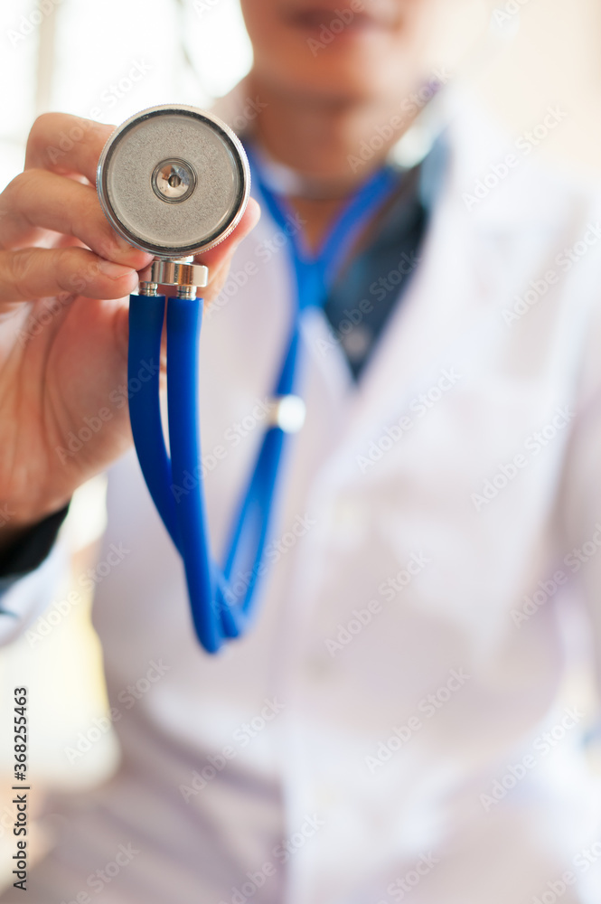 Wall mural a doctor with a stethoscope.