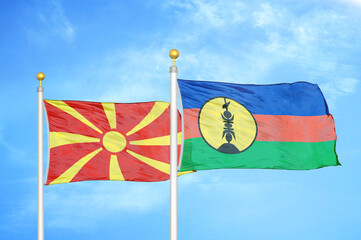 North Macedonia and New Caledonia two flags on flagpoles and blue sky