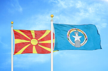 North Macedonia and Northern Mariana Islands two flags on flagpoles and blue sky