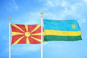 North Macedonia and Rwanda two flags on flagpoles and blue sky