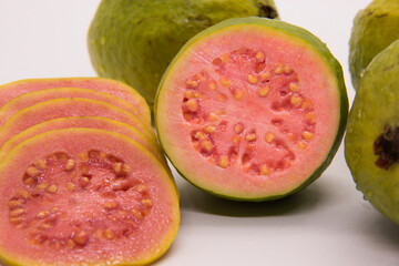 Some Brazilian guavas on white background. Tropical fruit.