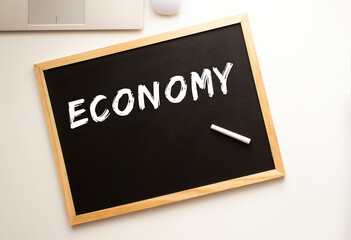 the text is written in chalk on a slate board. business concept
