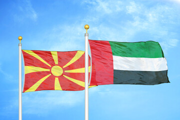 North Macedonia and United Arab Emirates two flags on flagpoles and blue sky