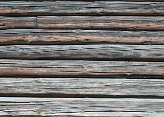 Weathered wood log wall. An old Russian and Scandinavian house. Grunge background for presentation, photos, mockups, inscriptions, installations.