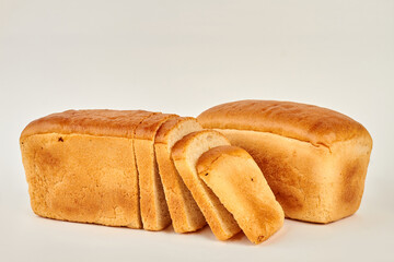 Sliced bread on white background. Fresh whole wheat bread. Space for text.