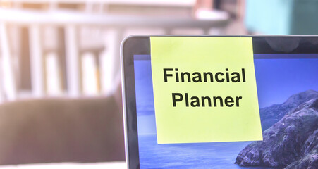 top view of words note on laptop computer screen with Financial planner text