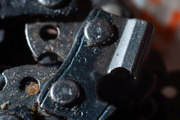 Chainsaw chain for cutting firewood close-up, macro shot