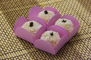 Traditional Brazilian sweet with grated coconut. Beijinho.
