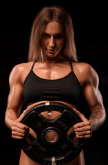 Fototapeta na wymiar Sexy athlete fitness girl in the gym