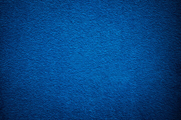 Perfect navy blue empty surface with some vignette.