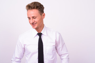 Portrait of happy handsome businessman with blond curly hair