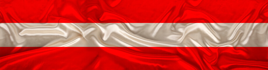 long panorama of the national flag of the state of Austria on delicate silk with folds, the concept of historical, tourism, emigration, economics, politics, global world trade