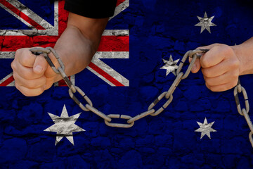 male hands break the iron chain, a symbol of bondage,protest against the background of national...