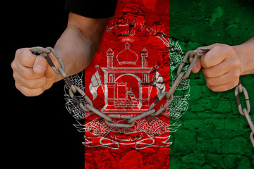 male hands break the iron chain, a symbol of bondage,protest against the background of the...