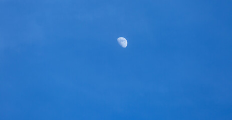 half moon during daylight background