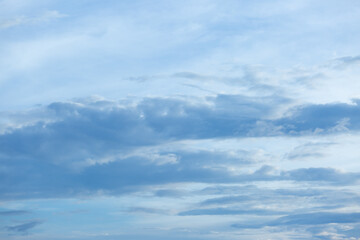 Fototapeta premium Blue sky background with tiny clouds.
