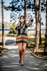 Fashionable woman wearing protective face mask  during pandemic