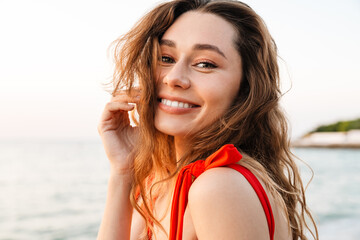 Beautiful smiling young woman wearing bikini