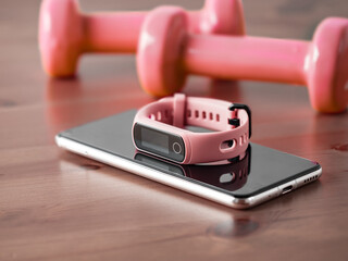 Fitness tracker on smartphone and pink colored dumb-bell on wooden tabletop. Pink female pedometer...