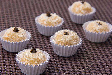Traditional Brazilian sweet with grated coconut. Beijinho.
