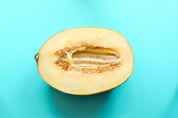 Top view of fresh ripe melon on blue background. Minimal food concept. Creative food. Close up