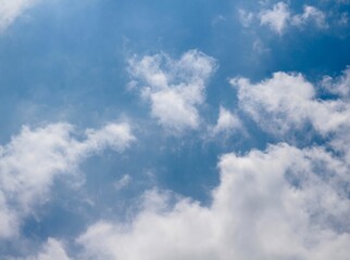 The white clouds in the blue sky.