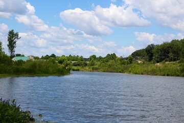 A beautiful view of the peaceful pond in the countryside.