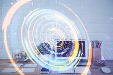 Fototapeta premium Computer on desktop in office with technology theme hologram. Double exposure. Tech concept.