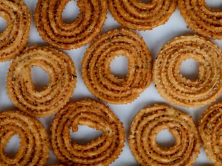 Nurukku or murukku a traditional Kerala snack made of rice powder   as texture, background